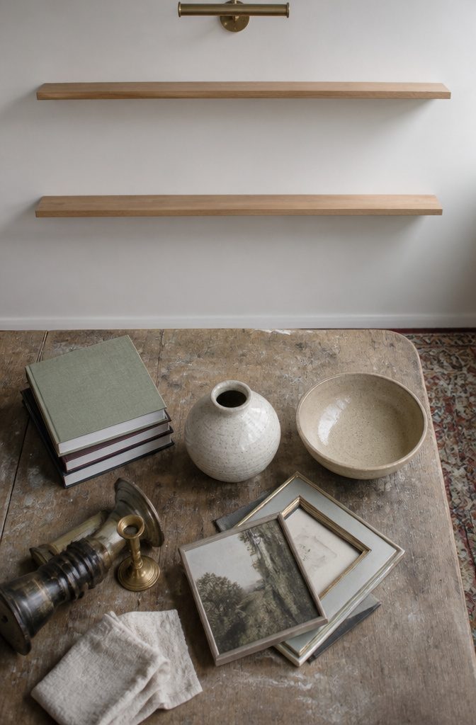 Empty wall shelves above a low cabinet in a home interior