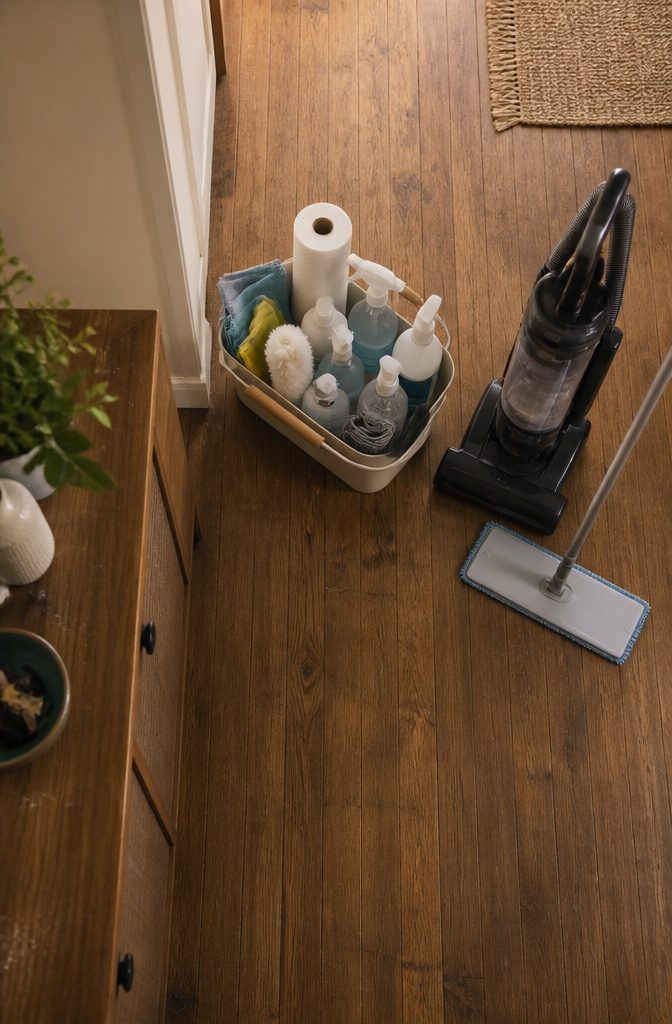 How to Clean Your House: 7 Steps for a Faster, Easier Reset 2 Cleaning caddy holding household cleaners, microfiber cloths, and other cleaning tools