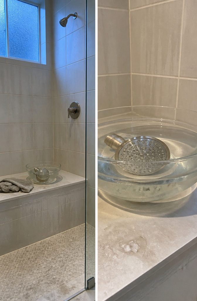 Showerhead soaking in a bowl of cleaning vinegar